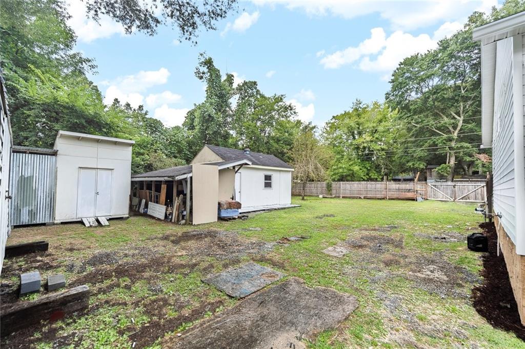 52 Glenda Drive Southwest Rome, GA 30165 - Photo 44 of 50 a view of a house with backyard and trees