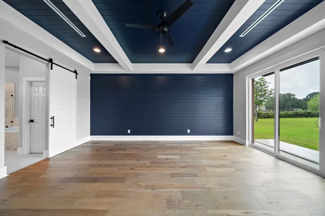 a view of an empty room with a fireplace