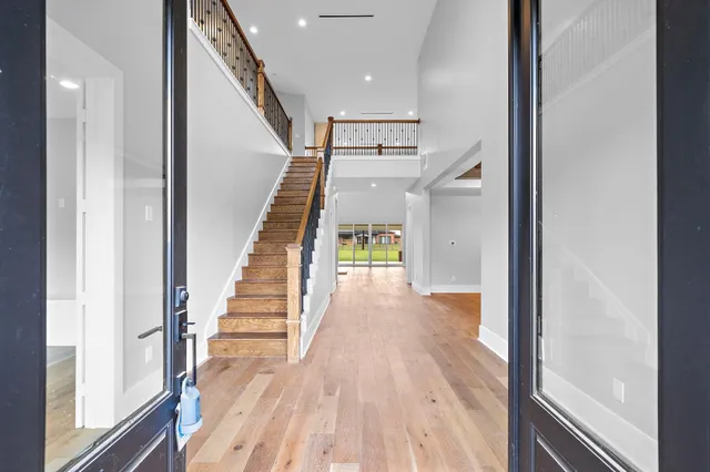 a view of entryway and hall with wooden floor
