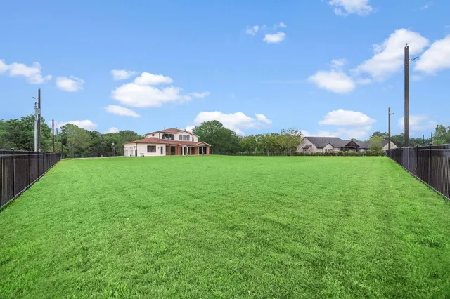 a view of a golf course with a lake