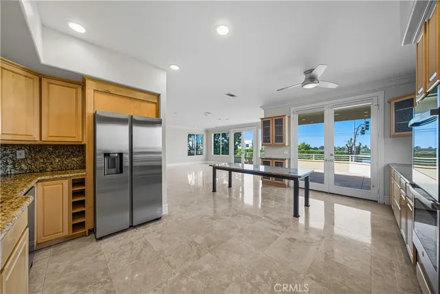 a view of empty room with fireplace and windows