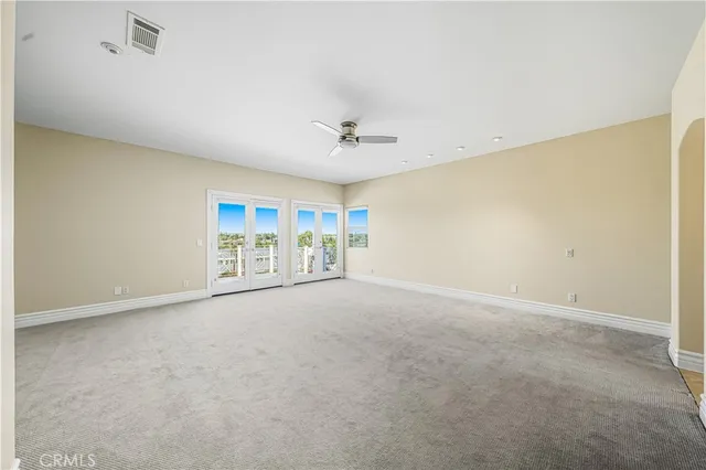 a view of a swimming pool with a lawn chairs and a table