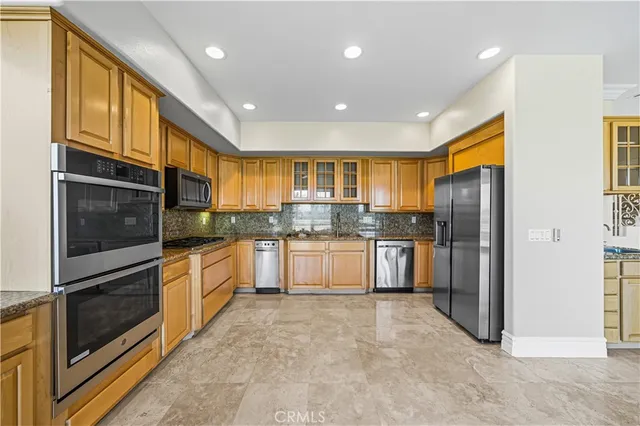 a living room with furniture a window and kitchen view