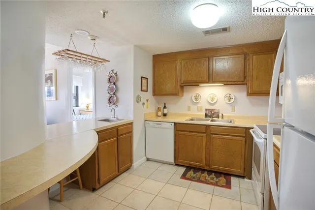 a kitchen with cabinets and window