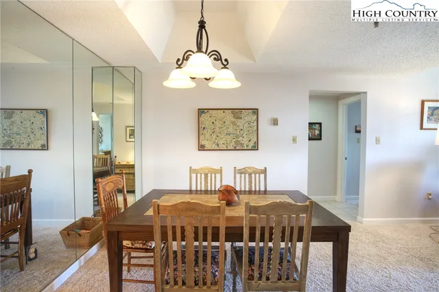 a bedroom with a bed and a table in it