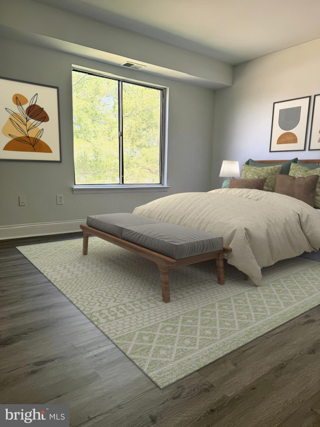 106 Mountain Road, Unit 2C Pasadena, MD 21122 - Photo 11 of 17 a bedroom with a bed and a large window