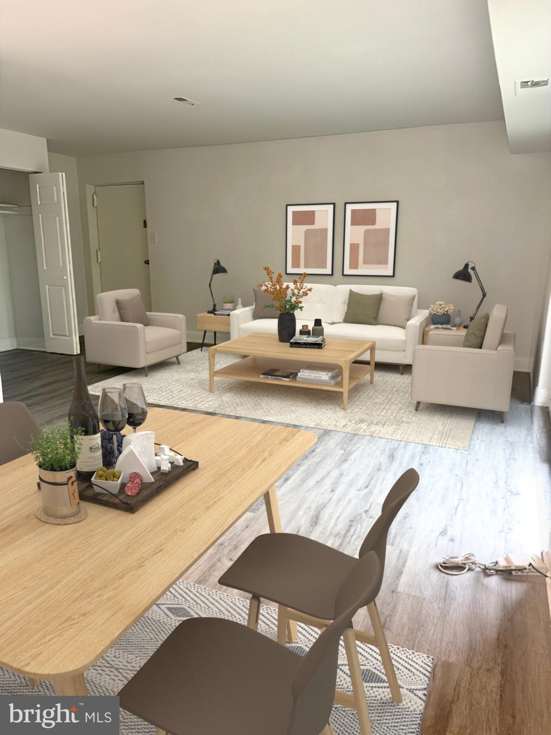 106 Mountain Road, Unit 2C Pasadena, MD 21122 - Photo 4 of 17 a living room with furniture and wooden floor