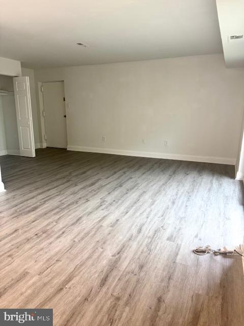 106 Mountain Road, Unit 2C Pasadena, MD 21122 - Photo 5 of 17 a view of a room and wooden floor