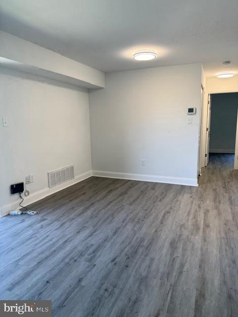106 Mountain Road, Unit 2C Pasadena, MD 21122 - Photo 7 of 17 a view of a room with wooden floor