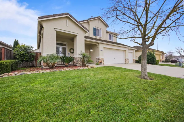 a open kitchen with stainless steel appliances kitchen island granite countertop a refrigerator and cabinets