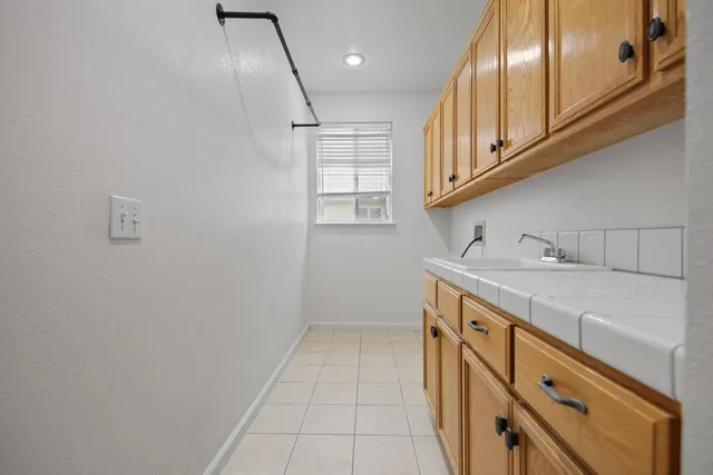 a bathroom with a bathtub sink and mirror
