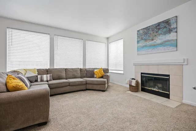 a bedroom with a bed and a ceiling fan