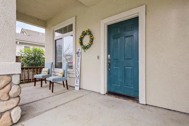 an entryway and livingroom with furniture