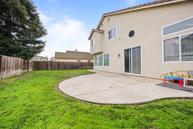 a spacious bathroom with a tub sink and mirror