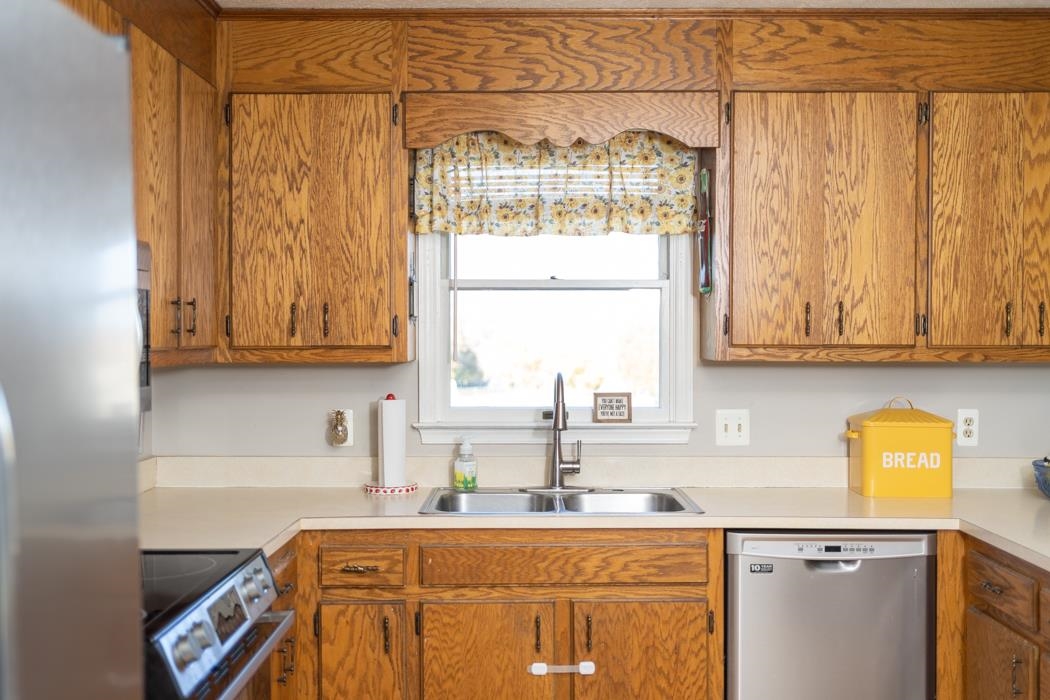 138 Buckboard Road Waynesboro, VA 22980 - Photo 13 of 54 a kitchen with stainless steel appliances a sink a window and cabinets