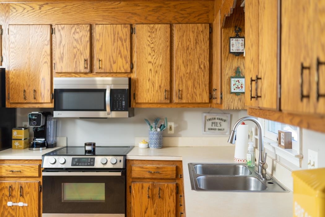 138 Buckboard Road Waynesboro, VA 22980 - Photo 14 of 54 a kitchen with stainless steel appliances granite countertop a stove and a microwave