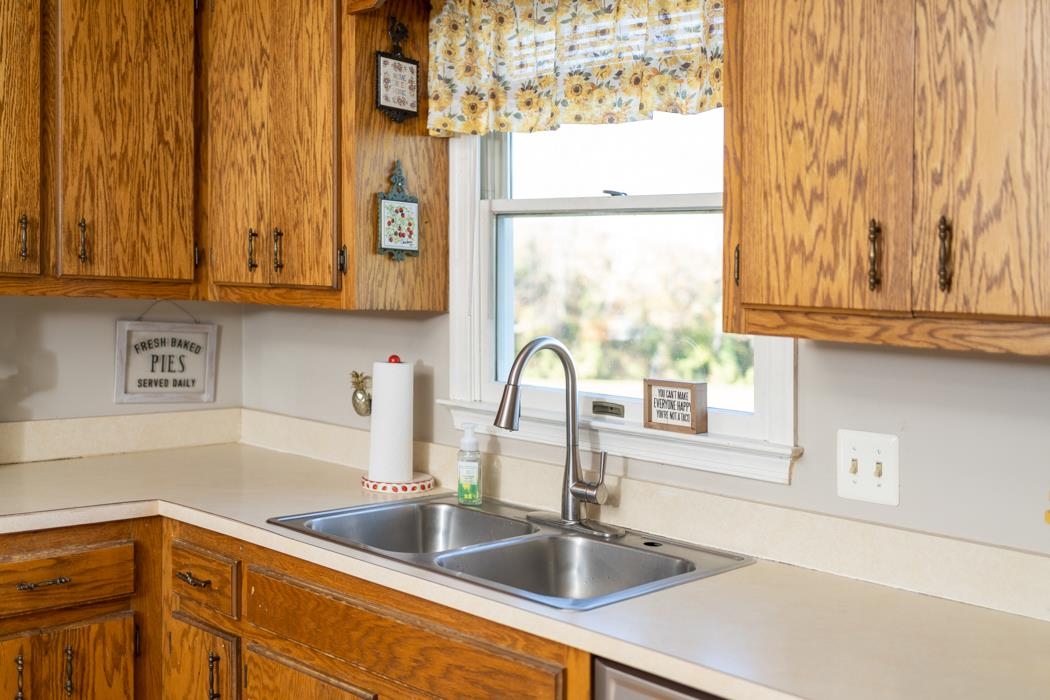 138 Buckboard Road Waynesboro, VA 22980 - Photo 15 of 54 a kitchen with stainless steel appliances granite countertop a sink and a window
