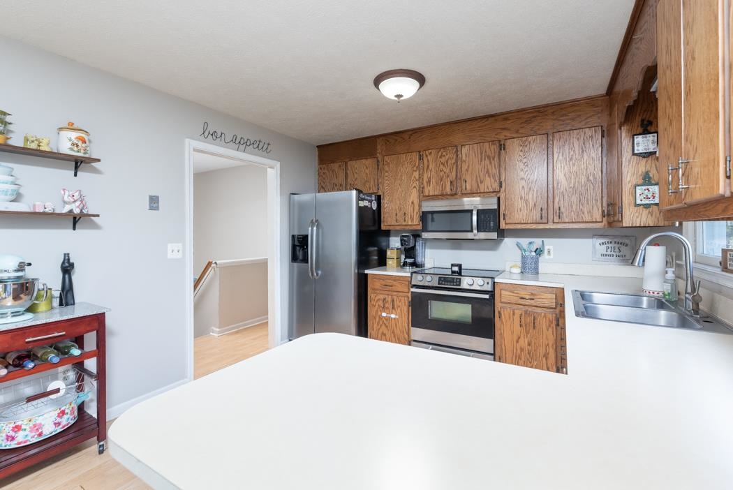 138 Buckboard Road Waynesboro, VA 22980 - Photo 17 of 54 a kitchen with stainless steel appliances granite countertop a refrigerator stove top oven a sink and dishwasher
