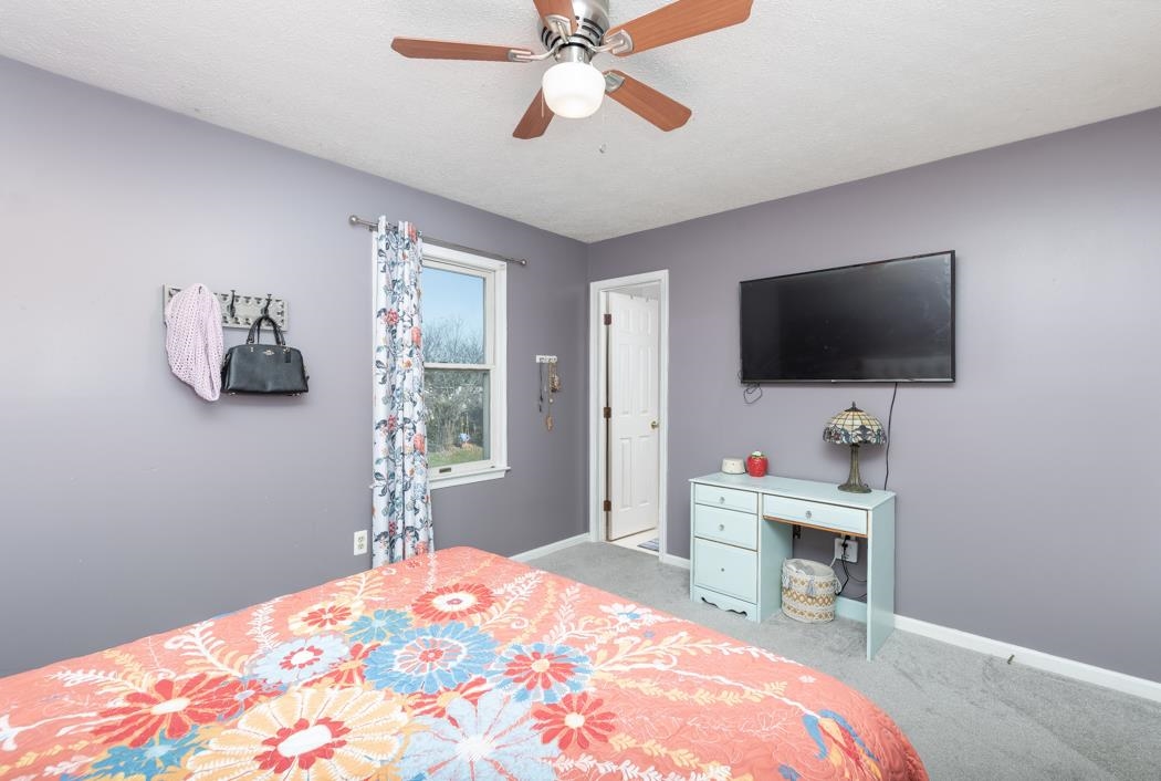 138 Buckboard Road Waynesboro, VA 22980 - Photo 24 of 54 a bedroom with a bed and a flat screen tv