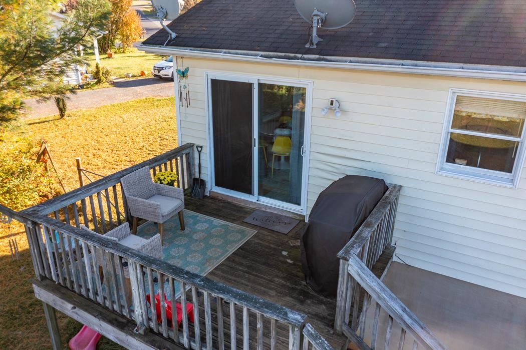138 Buckboard Road Waynesboro, VA 22980 - Photo 38 of 54 a balcony with wooden floor outdoor seating and dining space