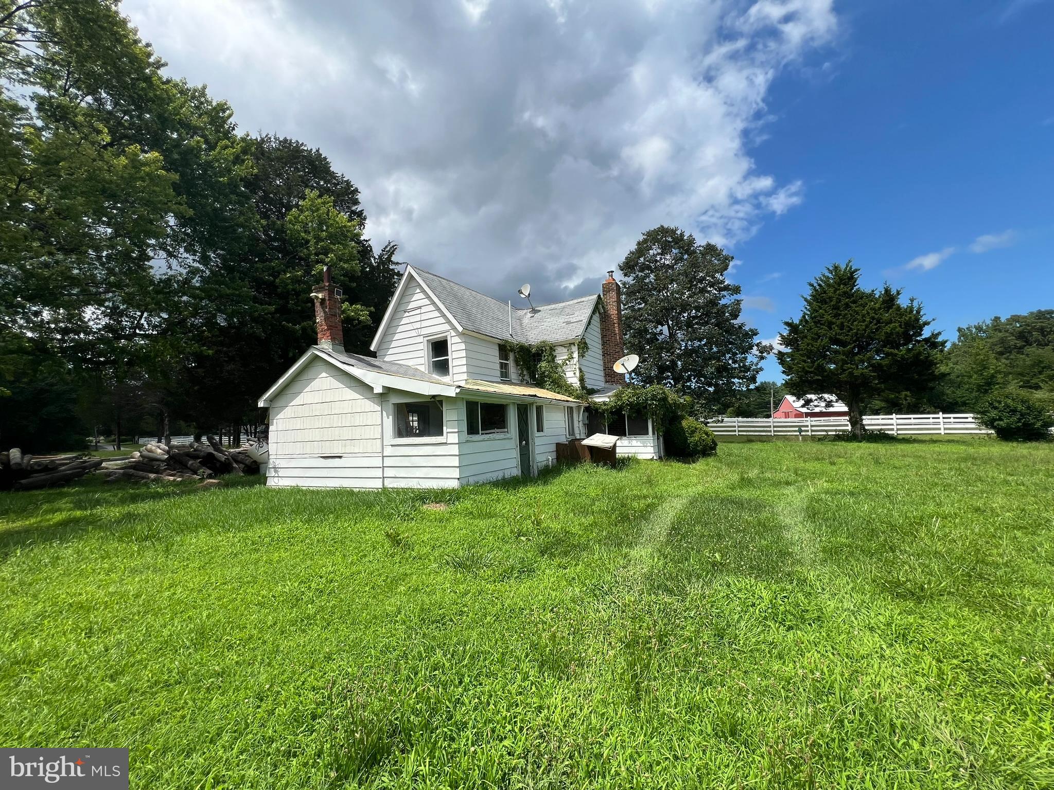 17507 Magruders Ferry Road Brandywine, MD 20613 - Photo 4 of 14 a front view of house with yard and green space