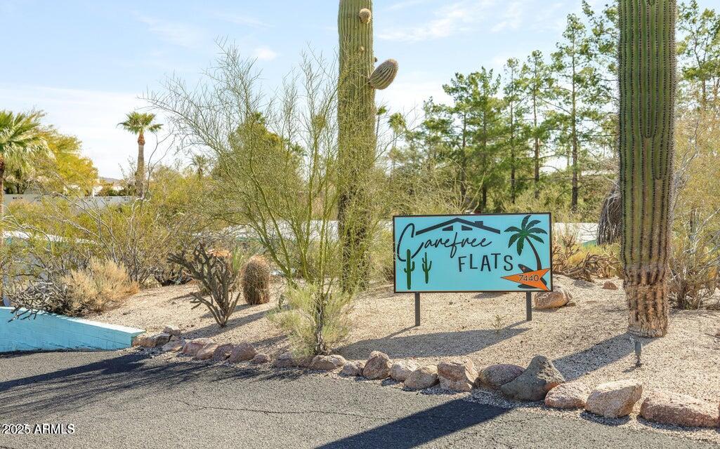 7440 East Cave Creek Road, Unit 6 Carefree, AZ 85377 - Photo 19 of 46 a street sign on a sidewalk next to a road