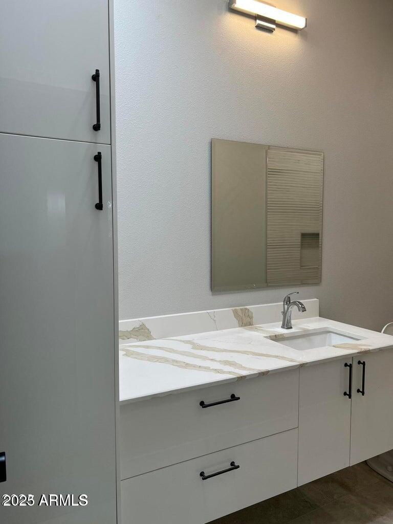 7440 East Cave Creek Road, Unit 6 Carefree, AZ 85377 - Photo 2 of 46 a bathroom with a sink and mirror