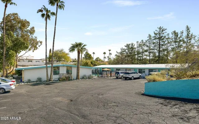 a sign that is on a pole on a street