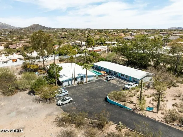 a view of a house with backyard porch and sitting area