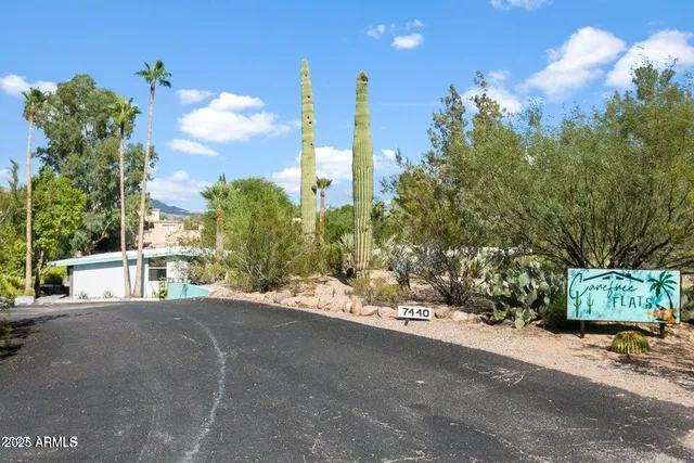 a view of a street with a building in the background