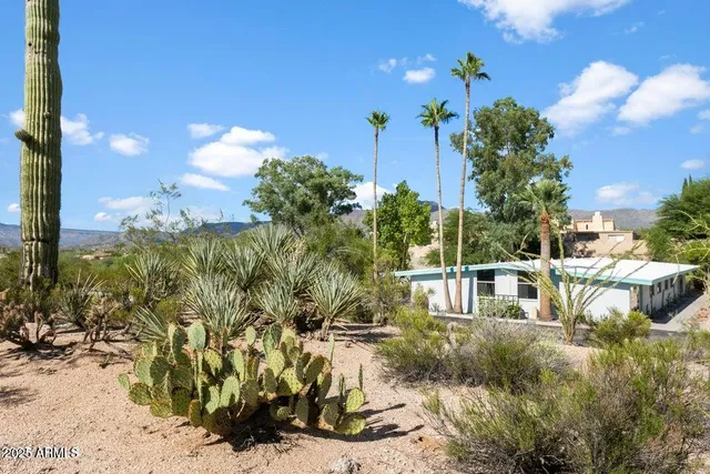 a view of houses with yard
