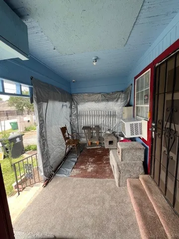 a room with furniture and a rug