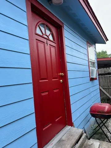 a view of a door and wooden floor