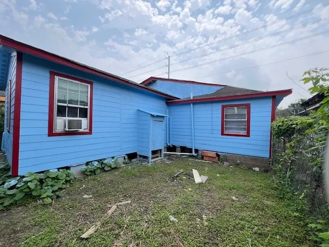 a backyard of a house with outdoor seating
