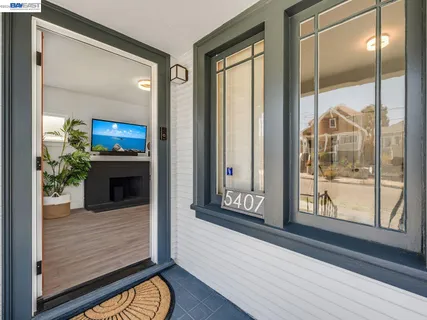 a view of a living room and a balcony