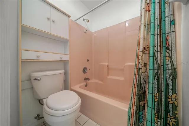 a bathroom with a bathtub and a toilet