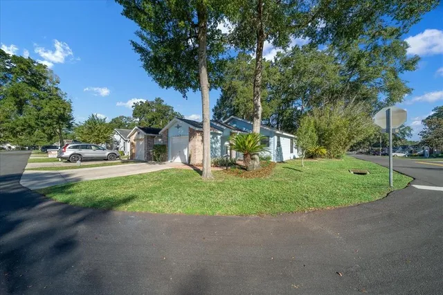 a view of outdoor space with garden and trees