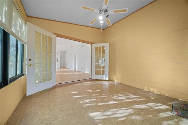 a view of an empty room with a fireplace