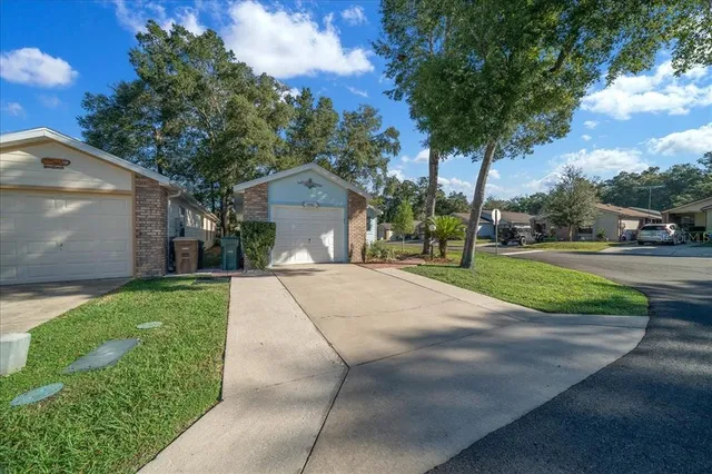 a pathway of a house with a yard
