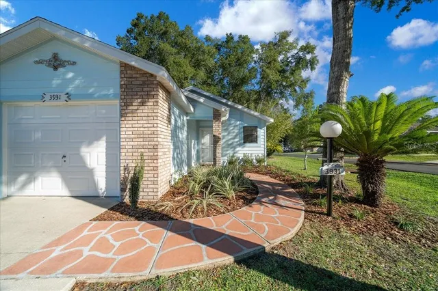 a view of a backyard with sitting area
