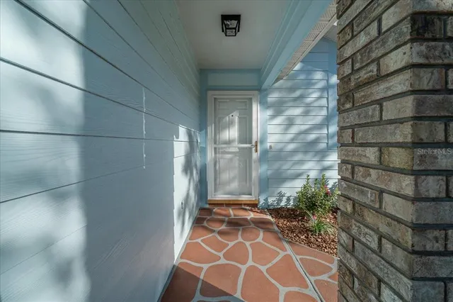 a view of a door and a window