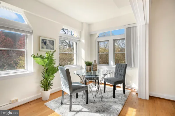 a view of a livingroom with furniture and wooden floor