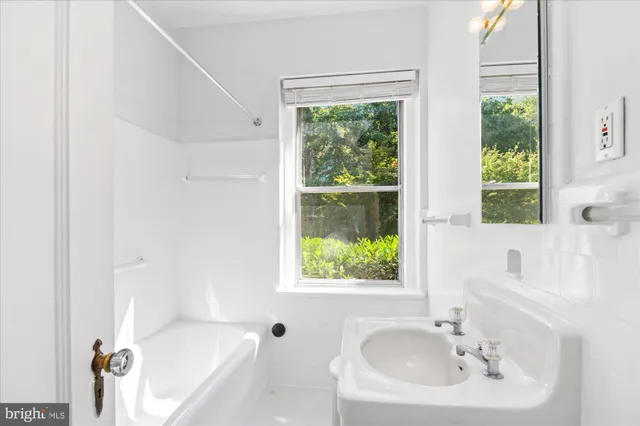 a bathroom with a sink and a bathtub