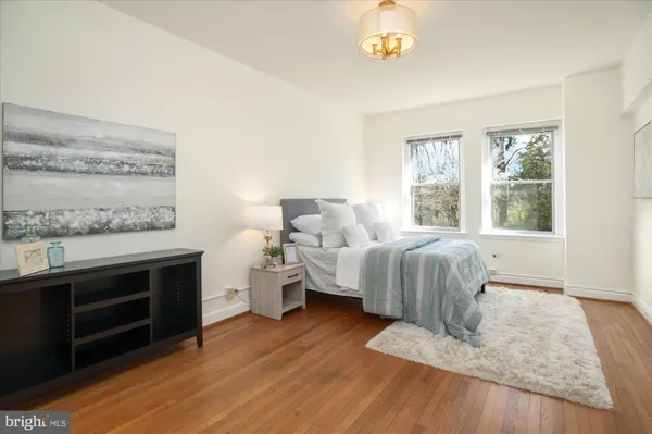 a bedroom with furniture and a fireplace
