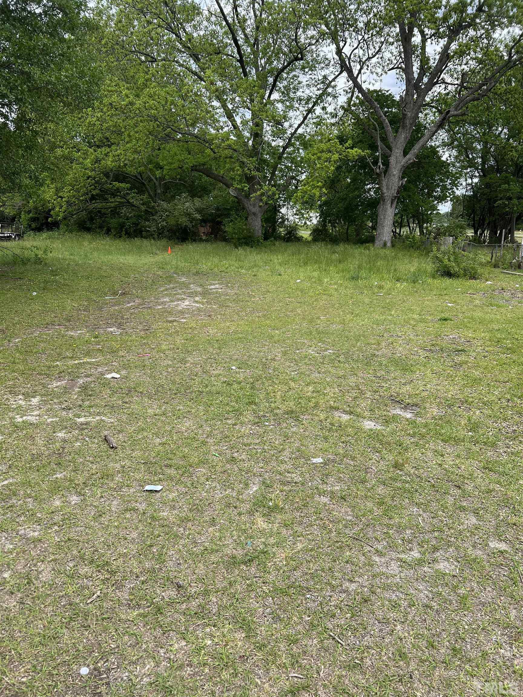 1021 East Edgerton Street Dunn, NC 28334 - Photo 1 of 5 a view of a yard with a trees