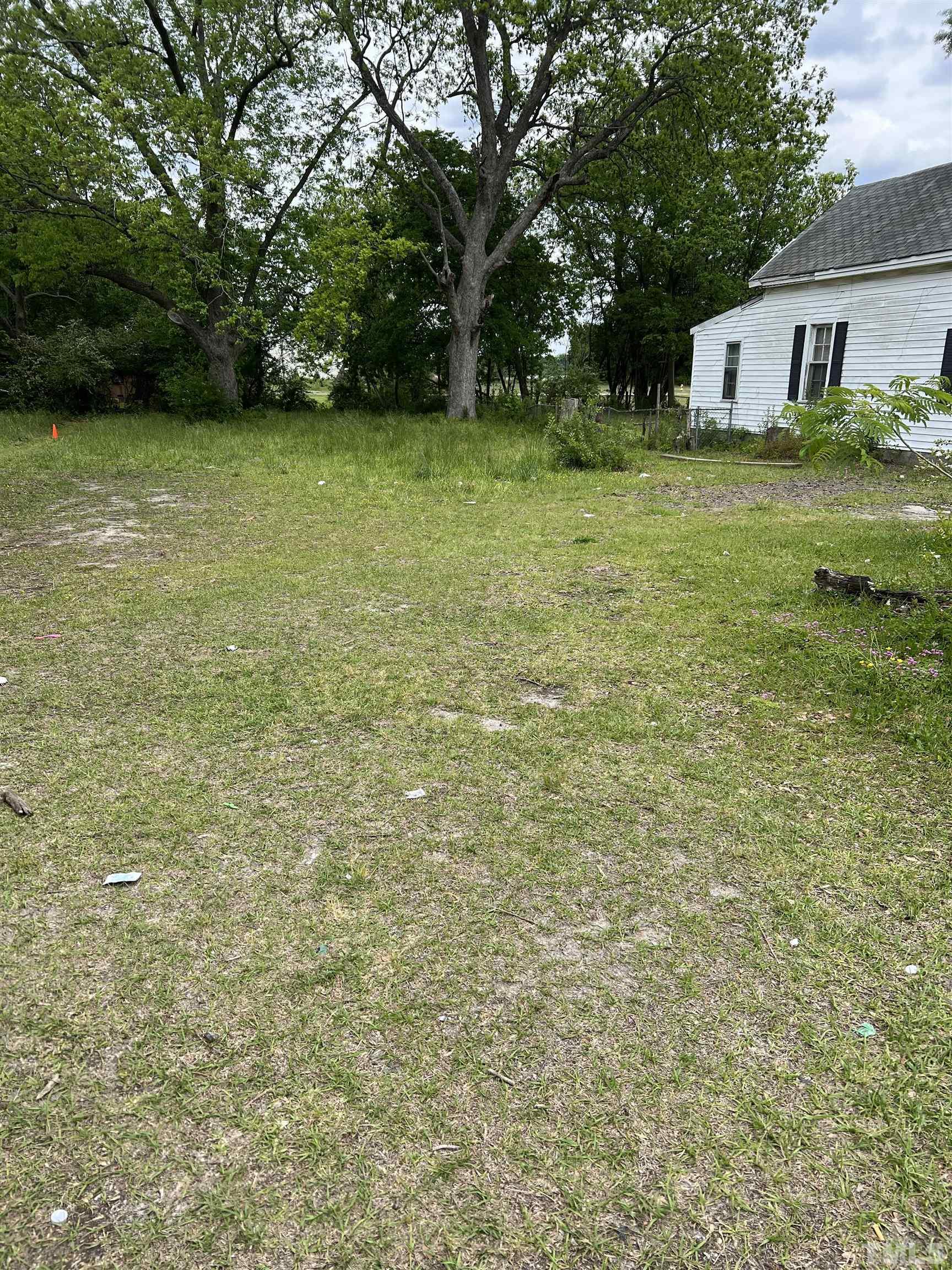 1021 East Edgerton Street Dunn, NC 28334 - Photo 3 of 5 a view of a backyard with a garden