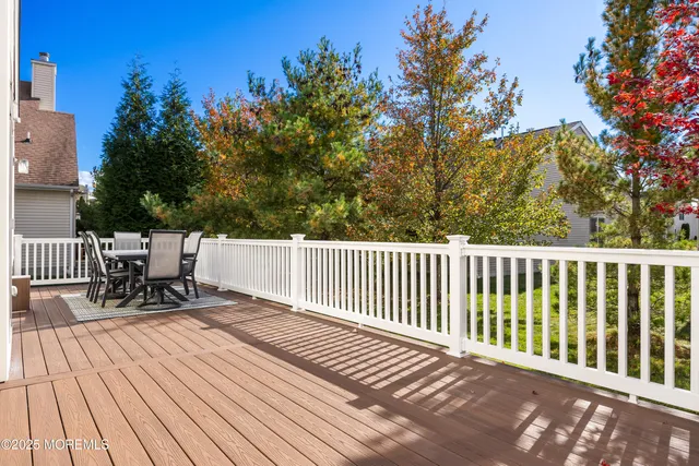 a view of a dinning table and chairs on deck