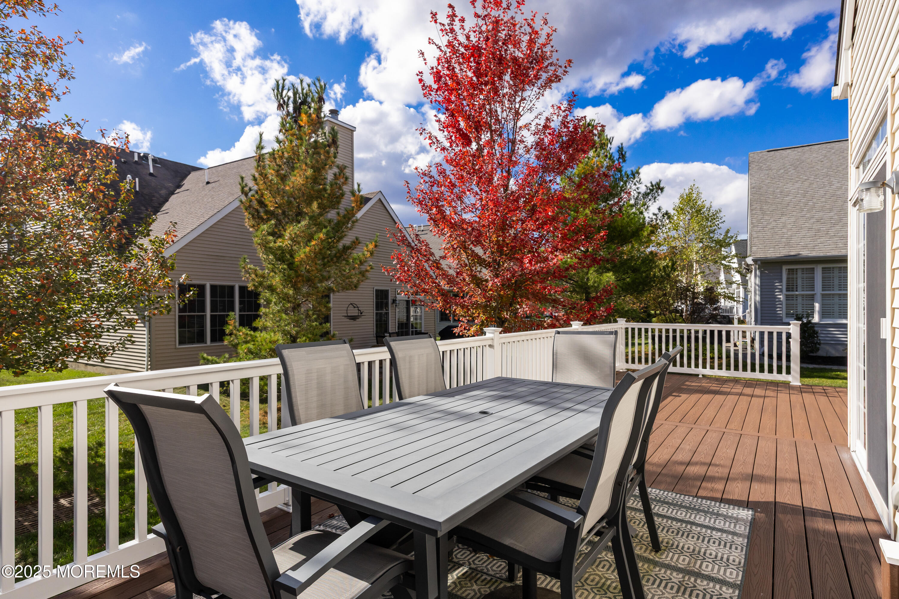 67 Sequoia Parkway Asbury Park, NJ 07712 - Photo 26 of 38 a view of a dinning table and chairs on deck