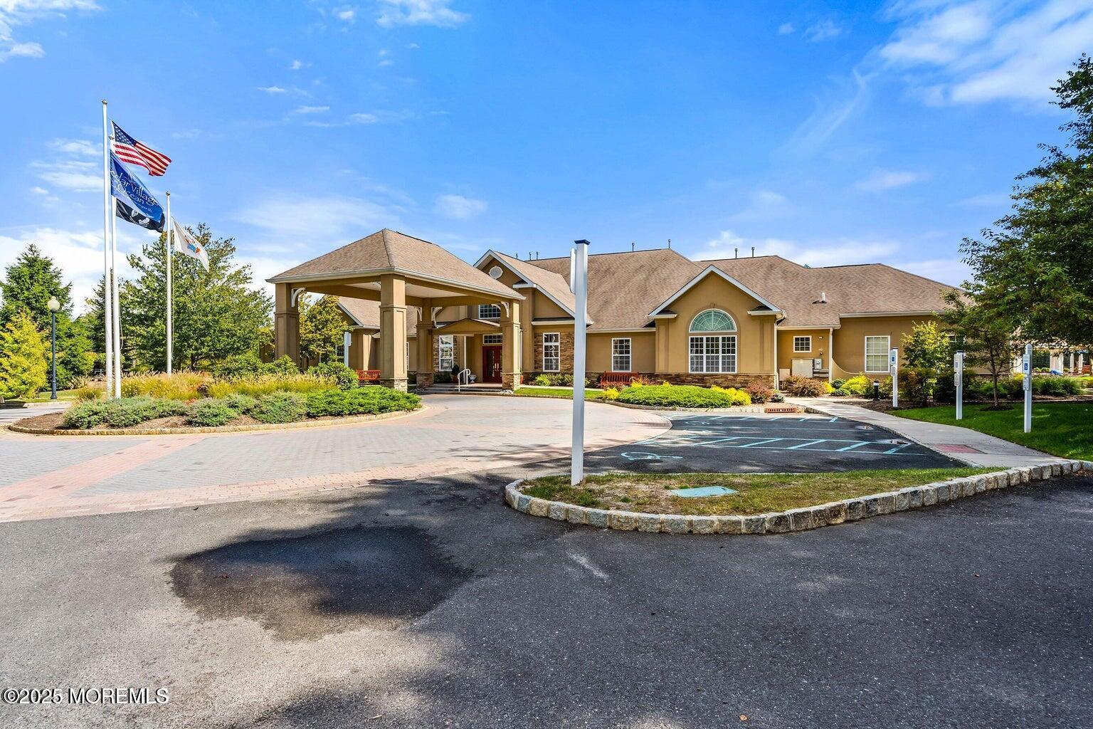67 Sequoia Parkway Asbury Park, NJ 07712 - Photo 29 of 38 a front view of a house with a yard and road
