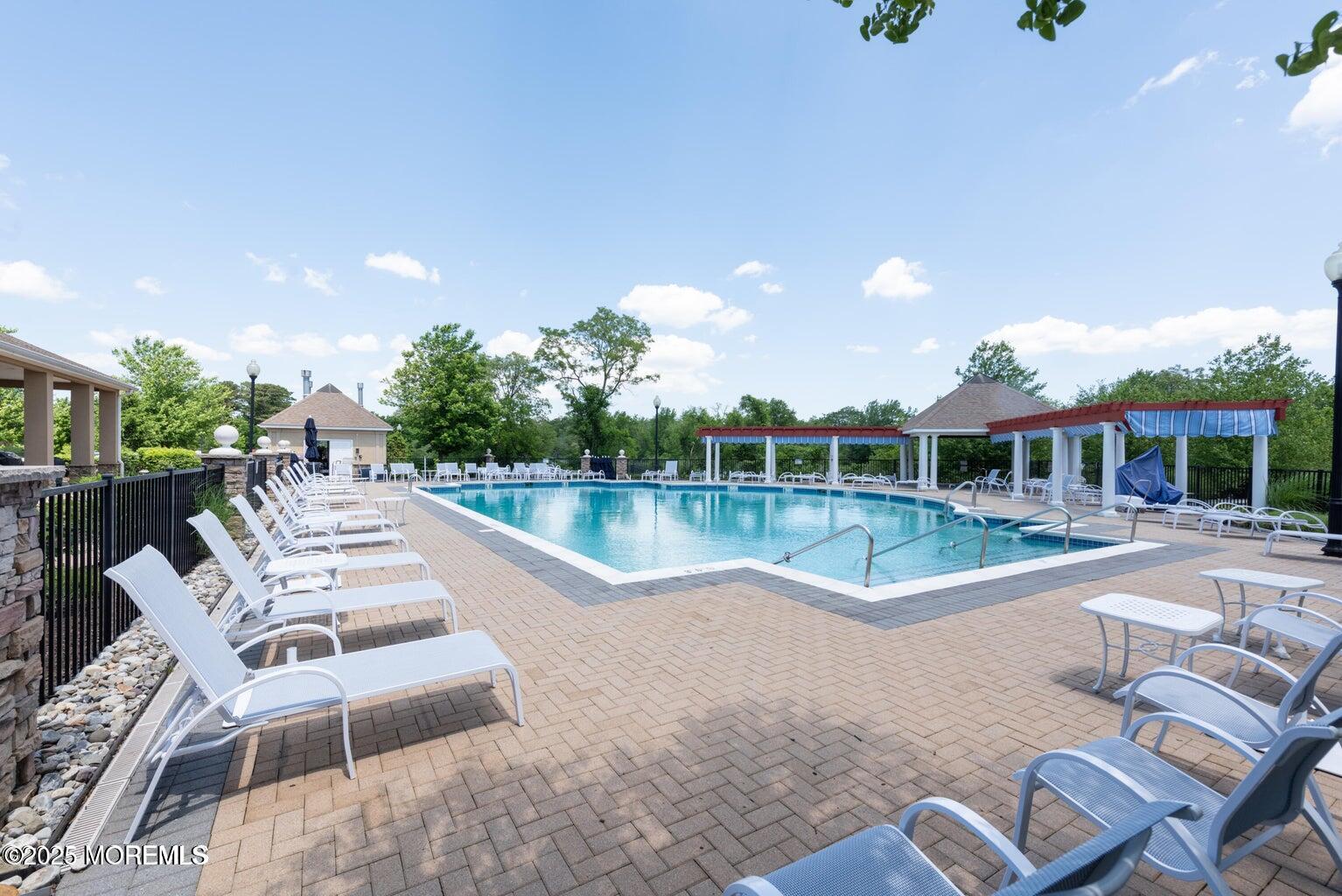 67 Sequoia Parkway Asbury Park, NJ 07712 - Photo 34 of 38 a view of a house with pool and chairs